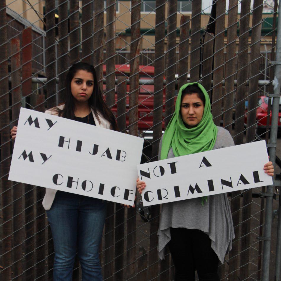 Juniors Hannah Alzgal and Zahra Hashmat pose for a photo titled No Justice, No Peace, a photography project by senior Avonlea Raschdorf.
