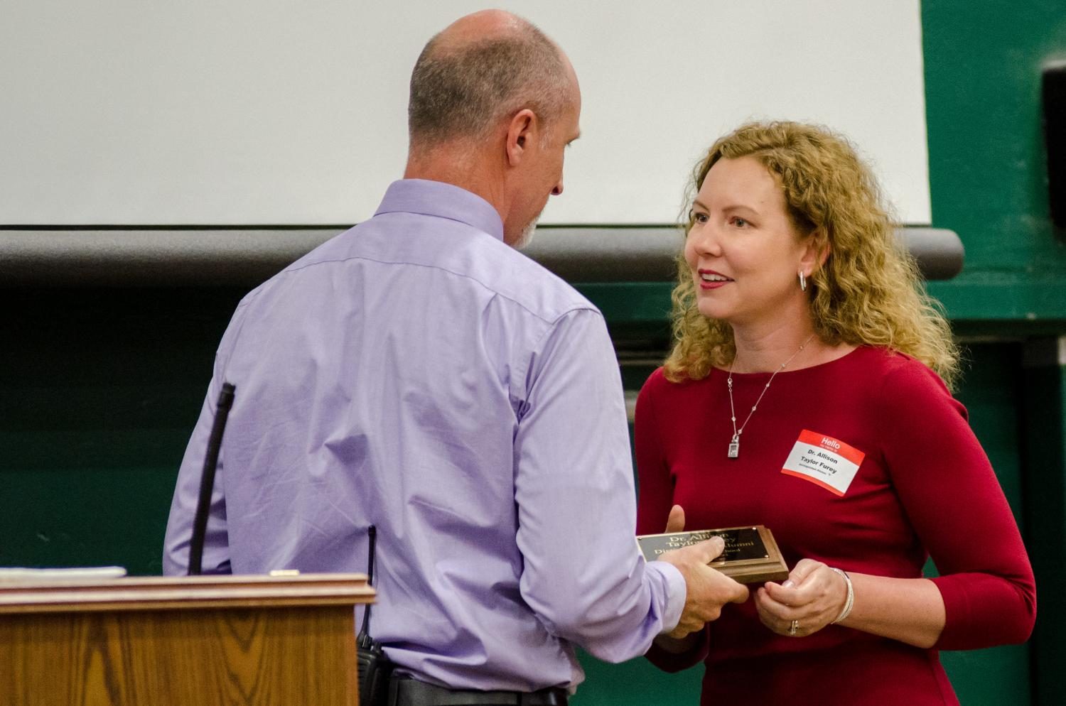 Dr. Allison Taylor Furey receives her Distinguished Alumni award at the Tiger Pride Assembly on April 28.