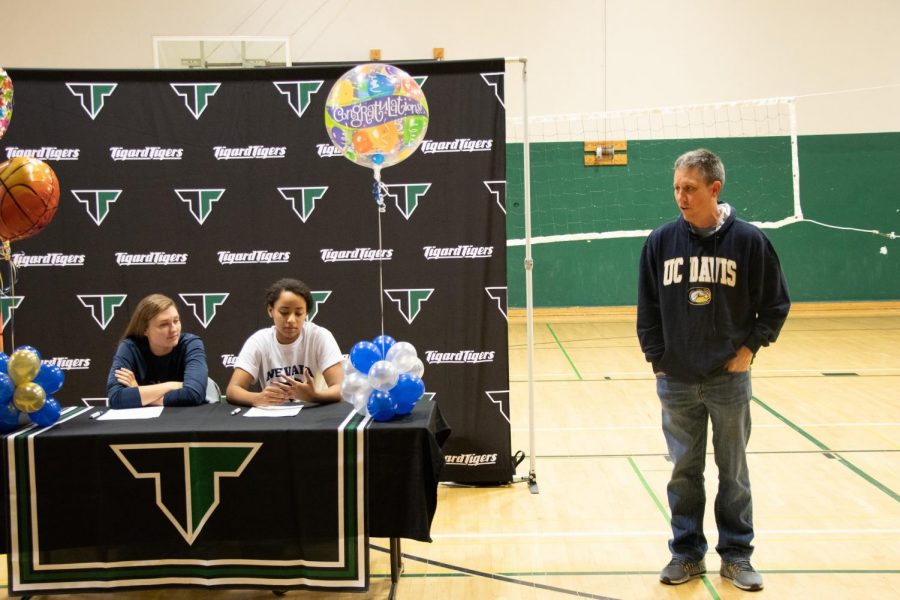 Campbell Gray and Gabby Brown sign letters of intent on Nov. 14. Gray plans to attend UC Davis to play basketball. Girls basketball head coach Steve Naylor talked briefly at the signing.