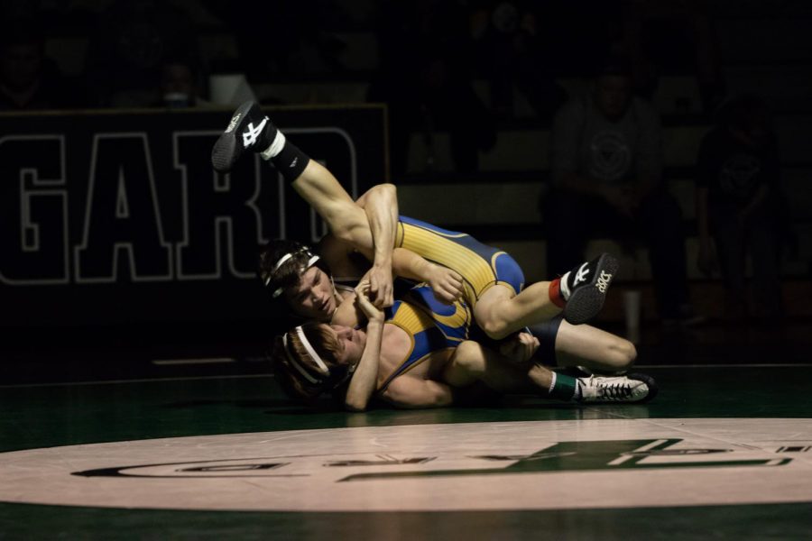 Cameron OConnor takes on Ty Ewers of Canby. OConnor won the match by techfall and helped Tigard win the dual meet 45-28.