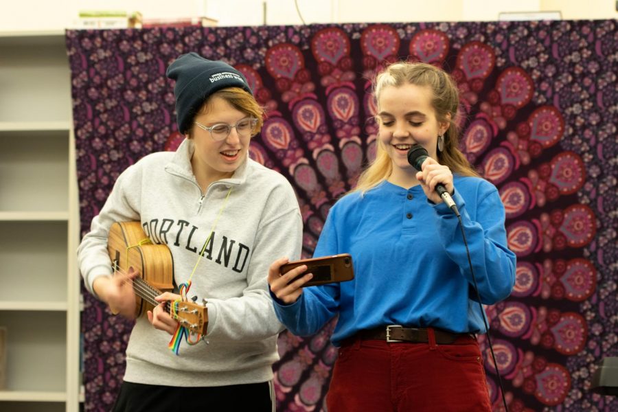 Junior Natalie Scharn and Senior Kara Petrick perform “Campfire Song Song” from Spongebob to wrap up the 2nd Open Mic Night  on Feb. 7.