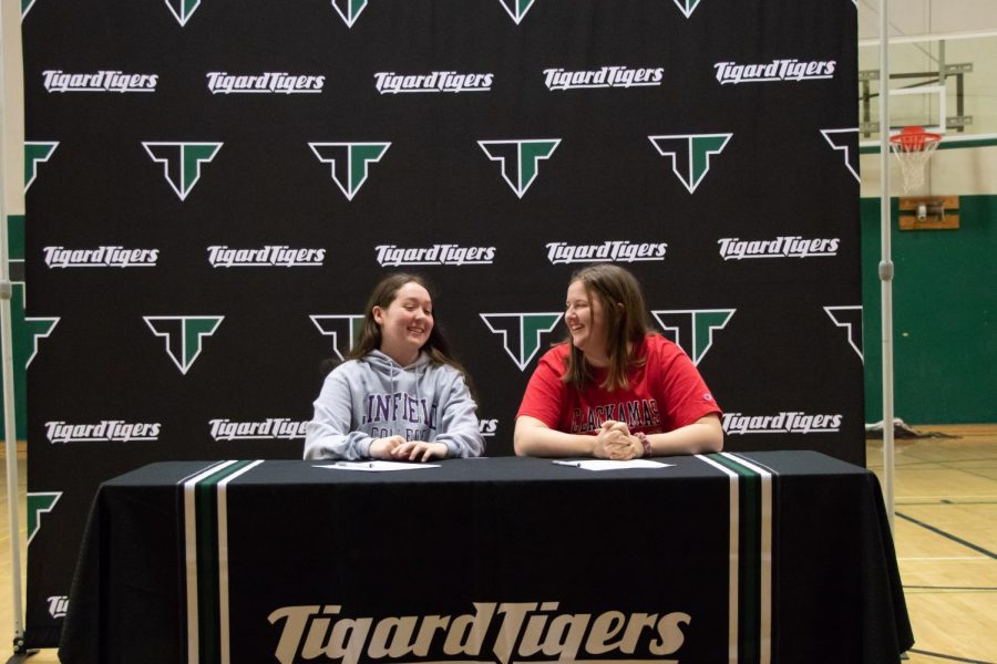 Paige La Fountain and Dani Lyons sign letters of intent. La Fountain will attend Linfield College and Lyons will attend Clackamas Community College.