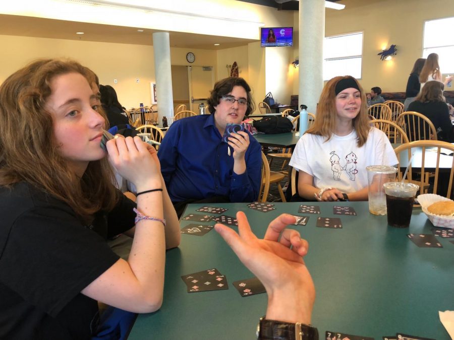 Speech and debate team huddles together at Western Oregon University. During their free time at the competition, they had card games, food runs, Goodwill hauls and swam in the Best Western hot tub.
