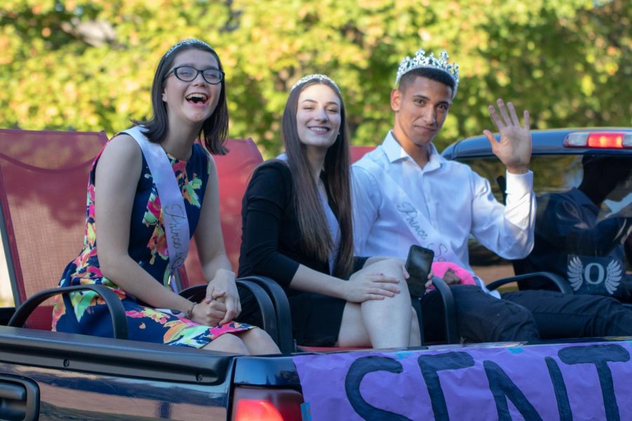 Senior+Tori+Lopez+is+real+Tigard+royalty.+Lopez+%28left%29+rode+in+the+homecoming+float+with+Linnea+Hill+and+Sajjad+Al+Rikabi.+Lopez+was+nominated+as+the+homecoming+queen+in+the+fall+and+a+Rose+Princess+this+spring.+%0A