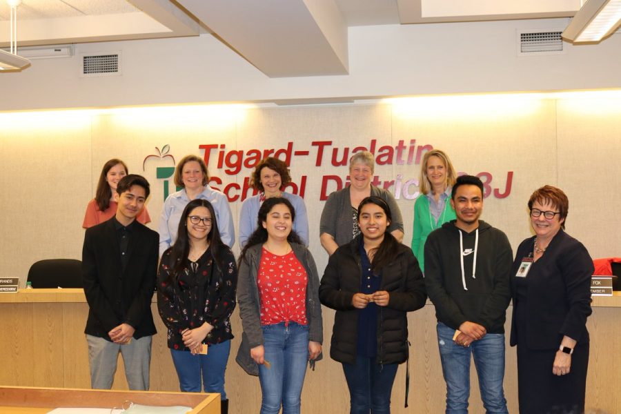 Senior Gloria Rosas Alcantara, senior Eddy Sanchez Mendez, Superintendent Rieke-Smith, board members and Tualatin High School seniors gather for a photo to celebrate the the initial group of students enrolled in the Diverse Educator Pathway Program. These seniors hope to be teachers in the district when they graduate from college.
