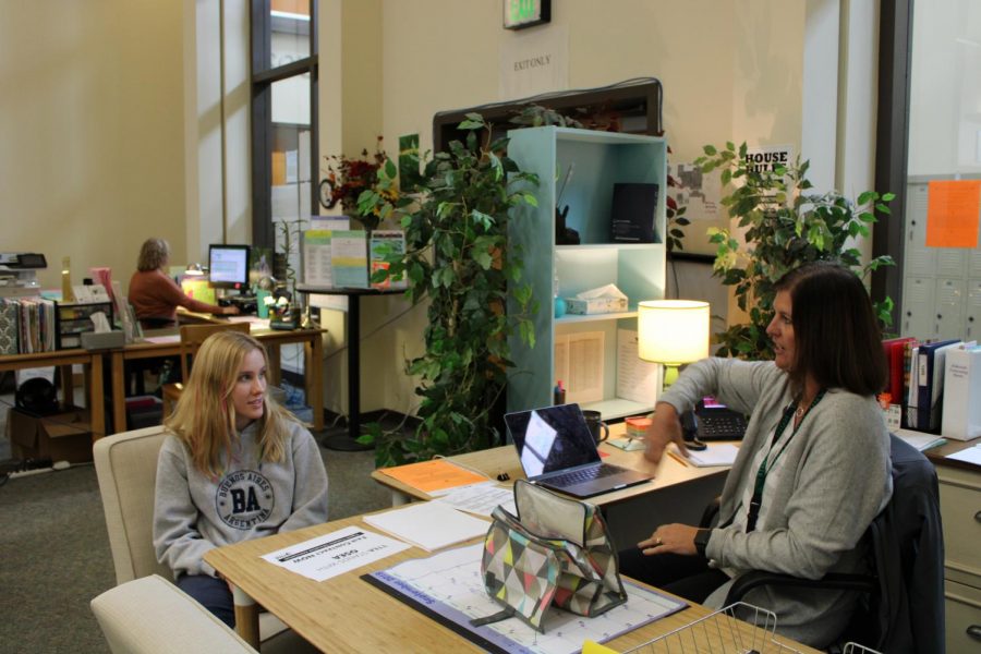 Counselor Tori Alderman chats with publications junior Sophie Fenton about the construction.  Alderman appreciated the students patience with the current lack of privacy in the counseling office.