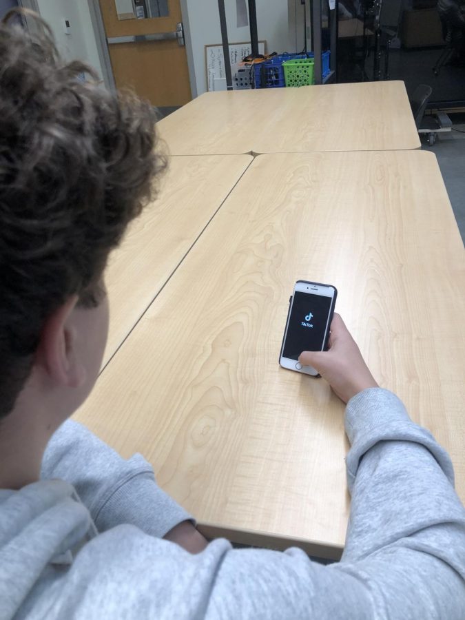 Owen Kosmala signs into TikTok in the pubs room. Kosmala spends 10 hours a week on TikTok alone, surpassing his Instagram and Snapchat use.