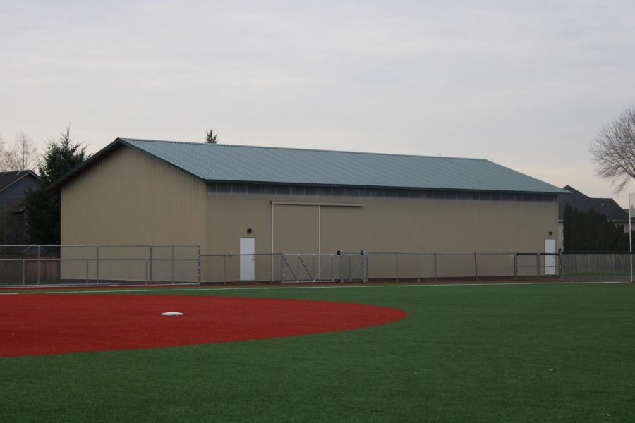 The new softball field and hitting barn, being finished now make a prominent impact on the upcoming softball season. 
