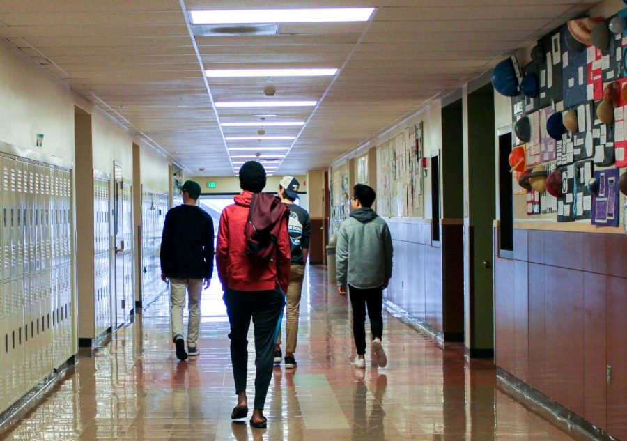 Although TTSD cancels school on March 13, students could come in and pick up books and computers. A group of junior boys wandered through the empty science hall.