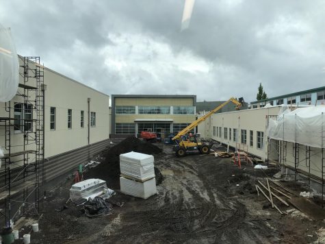 Although the courtyard is still a mud pit, the building is coming along around it. The business wing, commons and athletic wing will be ready for students in the fall.
