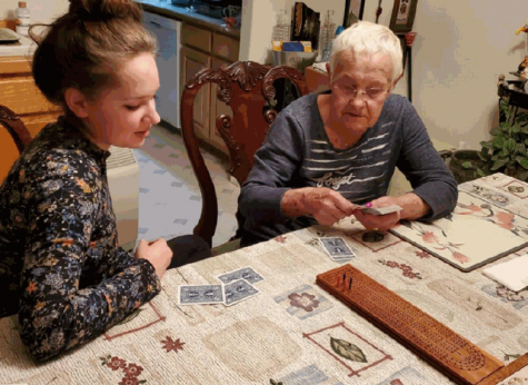 Deja Fitzwater and her grandmother play cribbage. Fitzwater has been living with her grandparents since distance learning began. 