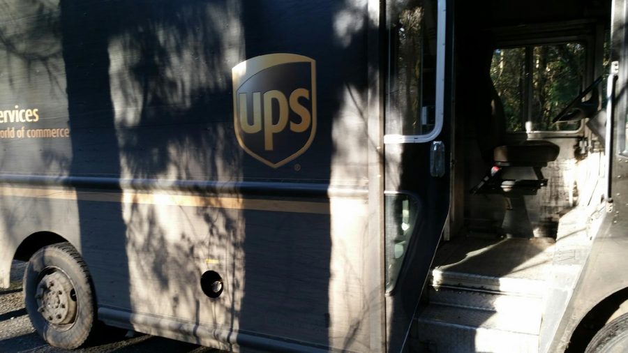UPS drivers like Robert Ervin work extra hours to deliver packages. More people have turned to ordering online rather than going into stores during the COVID-19 pandemic.