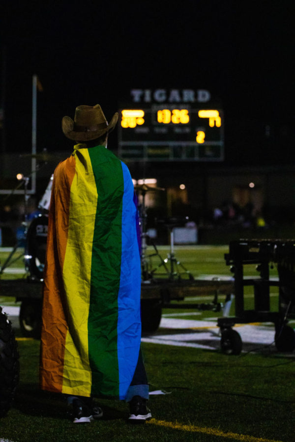A+band+member+shows+support+for+the+LGBTQ%2B+community+during+the+halftime+show+at+the+game+against+Newberg+on+Sept.+24.+The+school+supported+equity+groups+during+club+rush+on+Oct.+13.