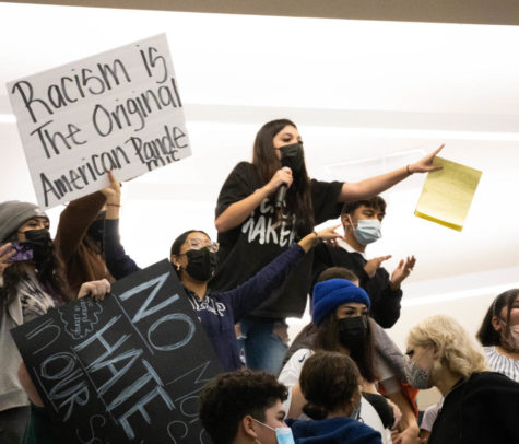 Students protest the district’s handling of an incident of hate speech