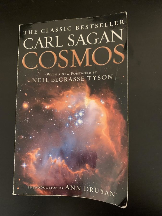 In Cosmos, author Carl Sagan traces the origin knowledge of scientific methods and theorizes about the future of science. The novel teaches readers more about their place in the universe. 