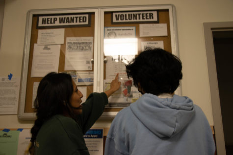 Sophomores Ava Hernandez and Adrien Palomo check out the job board in front of the College and Career Center. It is a great time to look for a summer job.
