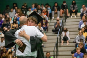 At senior awards assembly, Karson Boschma gets a hug from his dad.