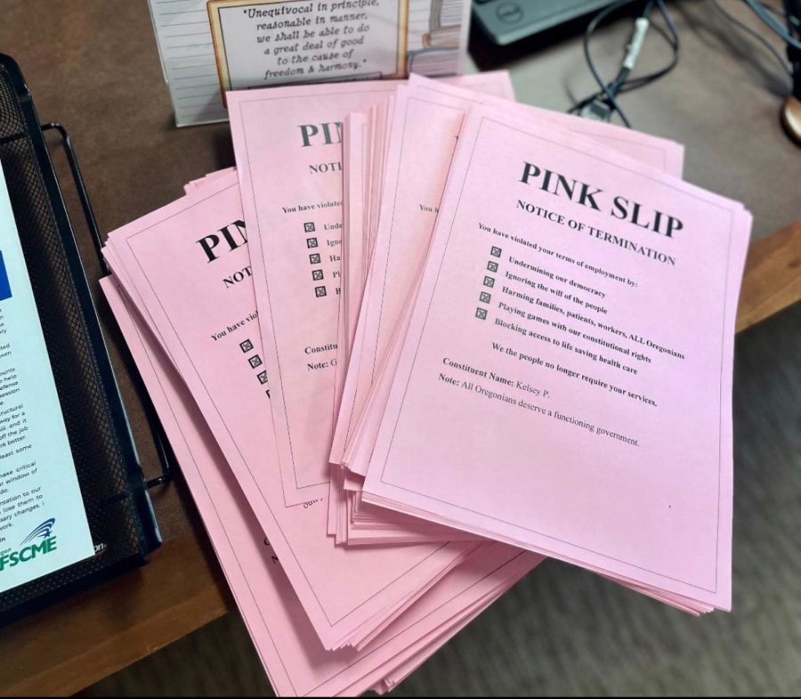 Courtesy of the ACLU  of Oregon, members drop off pink slips that show their discontent with the Senate walkouts. 